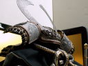 なんと蛇革を素材に用いた兜です。シンプルに金屏風で飾った五月人形